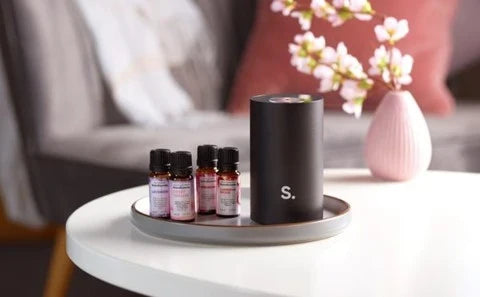 The five oils in the Signature Perfume Collection — each built around a distinct designer character, formulated for room diffusion